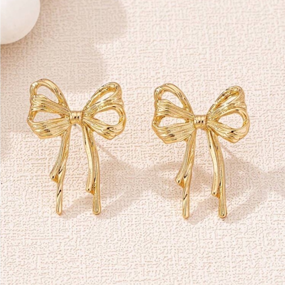 Double bow gold stud earrings soft girl era 2026 trendy season